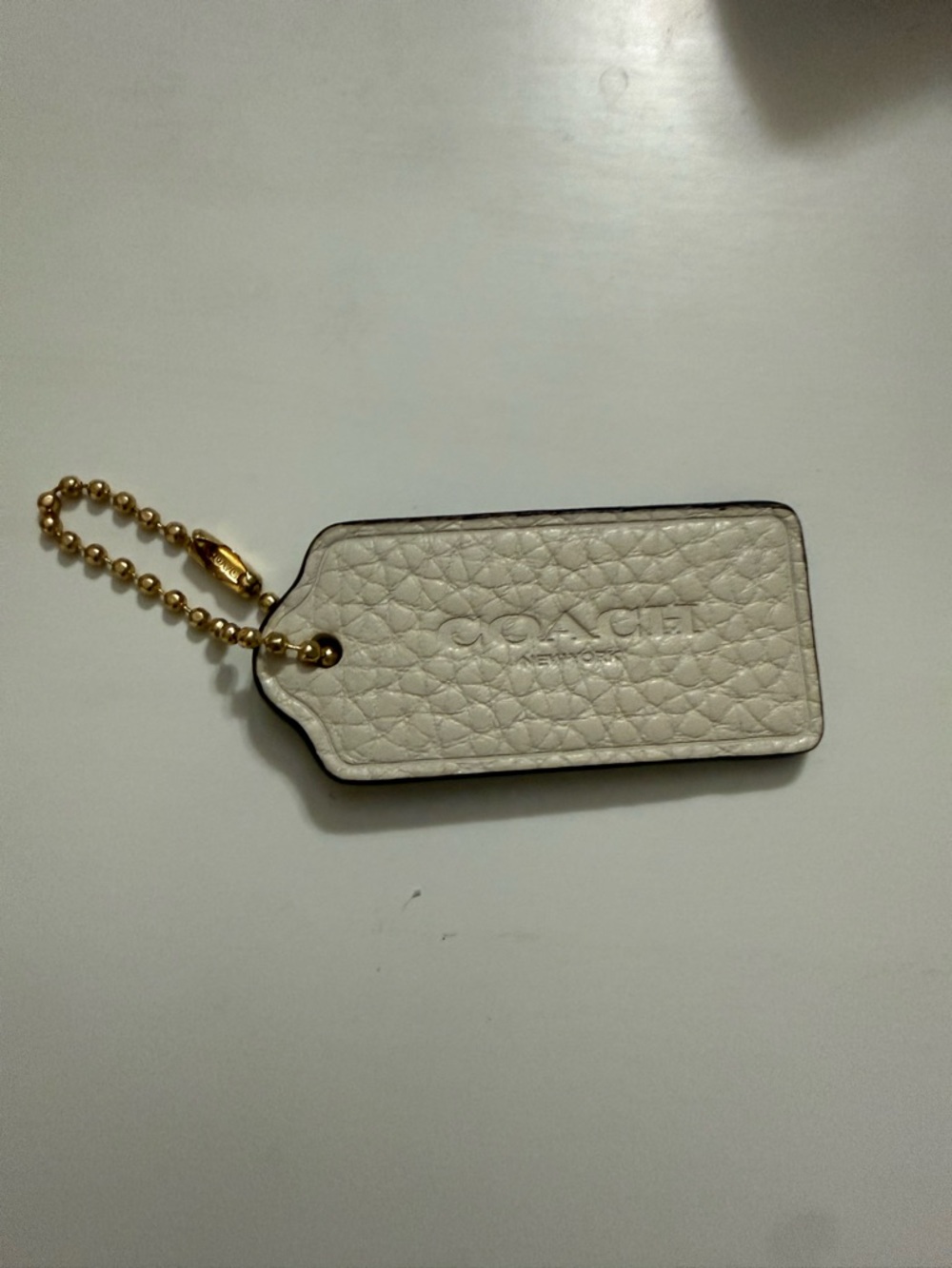 COACH White Pebbled Leather Bag Tag with Gold Ball Chain